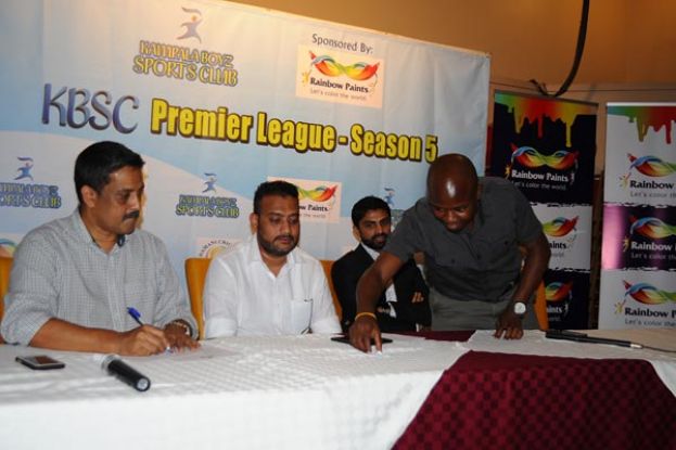 Battlelines Drawn. UCA Operations Manager Martin Ondeko (R) participates in the draw making ceremony of the KBSC Night Cricket Premier League - Season 5 draw as organising committee chairman Sanjiv Patel (L), the chairman KBSC Tejas Patel (2nd L) and event sponsor Tulsi Varsani of Sadolin Paints closely follow on Thursday at Lugogo. PHOTO BY EDDIE CHICCO 