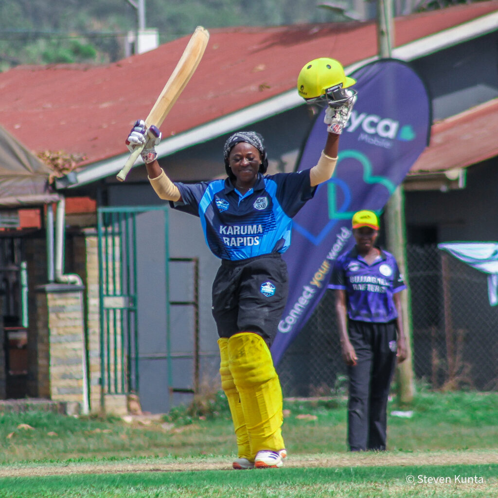 Musamali risisng up her bat after scoring a century